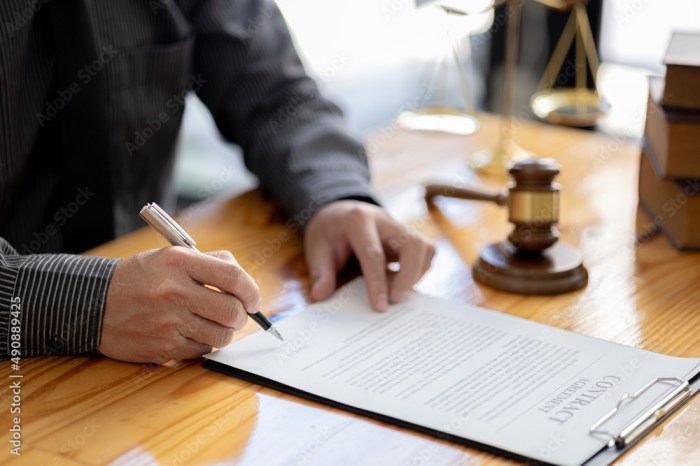 Contracts lawyers evaluate legal document signing